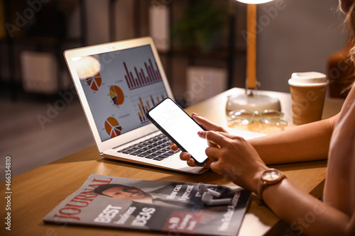 Businesswoman using mobile ...