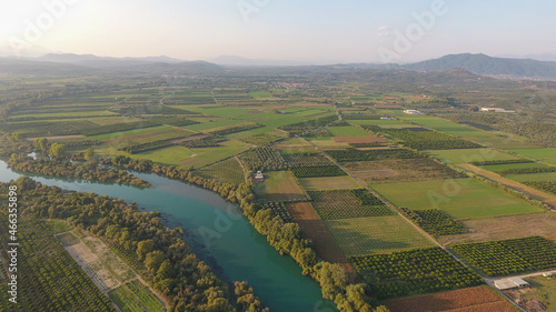 Aerial view of trees and farmland next to Acheloos river in West Greece