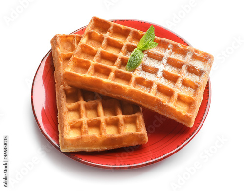 Plate with delicious Belgian waffles and mint on white background