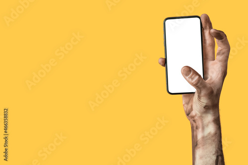 Hand of zombie with mobile ...