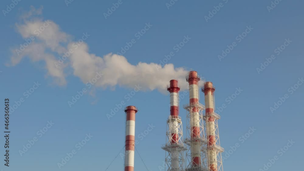 Pipes of a power plant (CHP) emitting white smoke Pipes of a power plant (CHP) emitting white smoke