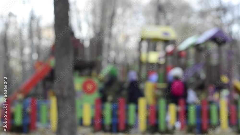 Blurred view of people walking in the park. Soft focus background Blurred view of people walking in the park. Soft focus background