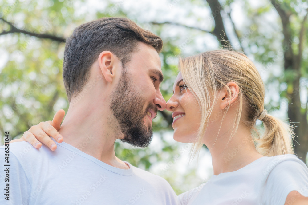 caucasian couple having romanatic moment together in park caucasian couple having romanatic moment together in park