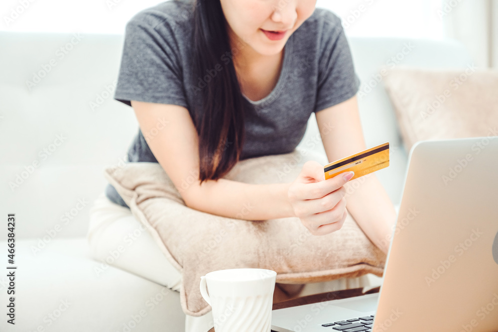 Online banking Woman using Laptop with credit card online shopping , Fintech and Blockchain concept at home Online banking Woman using Laptop with credit card online shopping , Fintech and Blockchain concept at home