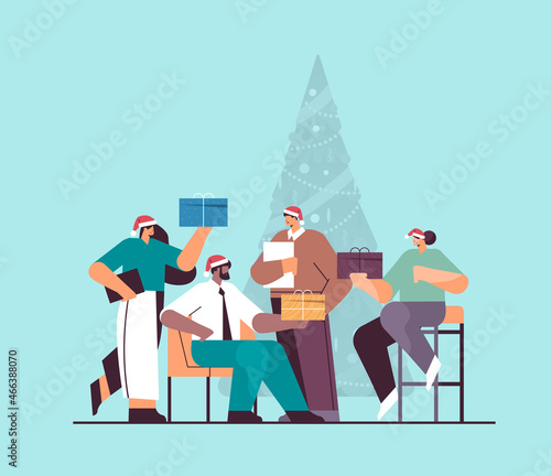 people in santa hats holding gifts businesspeople celebrating corporate party new year christmas holidays celebration
