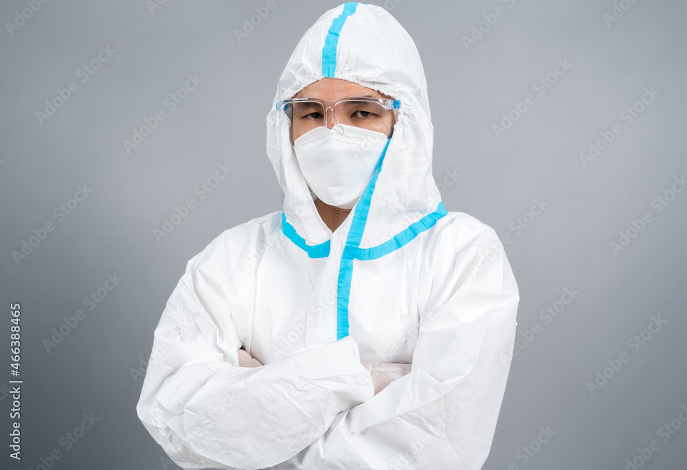 doctor man with crossed arms, wearing PPE suit against coronavirus(covid-19) doctor man with crossed arms, wearing PPE suit against coronavirus(covid-19)