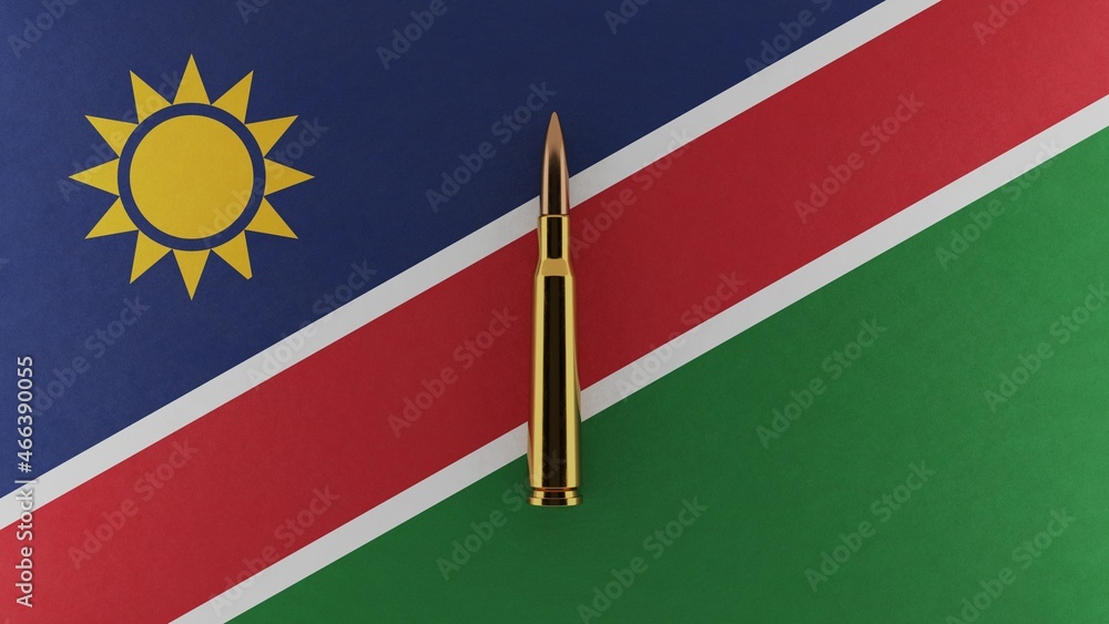 Fototapeta premium 3D rendering of top down view of a single rifle bullet in the center and on top of the national flag of Namibia