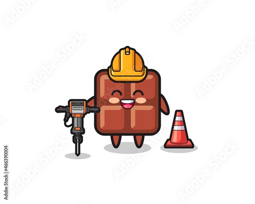 road worker mascot of chocolate bar holding drill machine