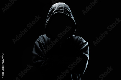 Cyber security concept. An adult online anonymous internet hacker. photo