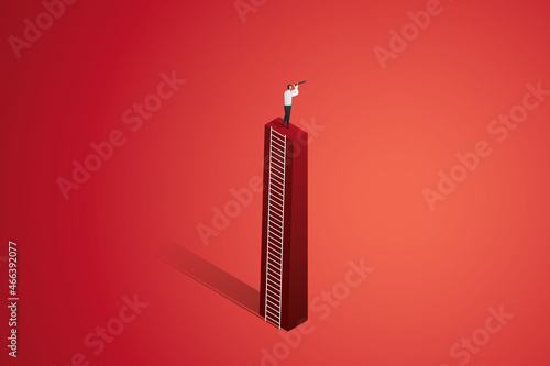 Businessman looking through binoculars on top of a graph.