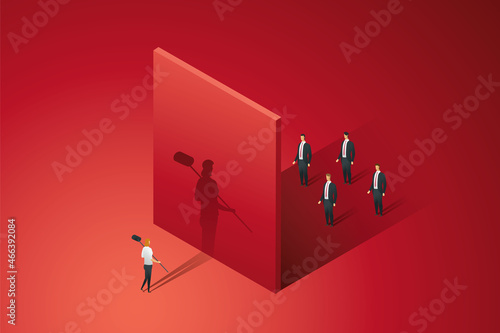 Businesswoman holding a hammer stands front red wall break a hole.