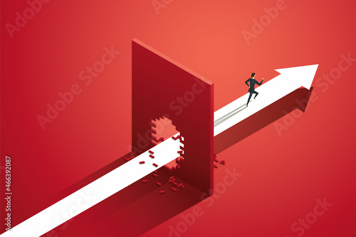 Businesswoman running arrow path breaking red wall.