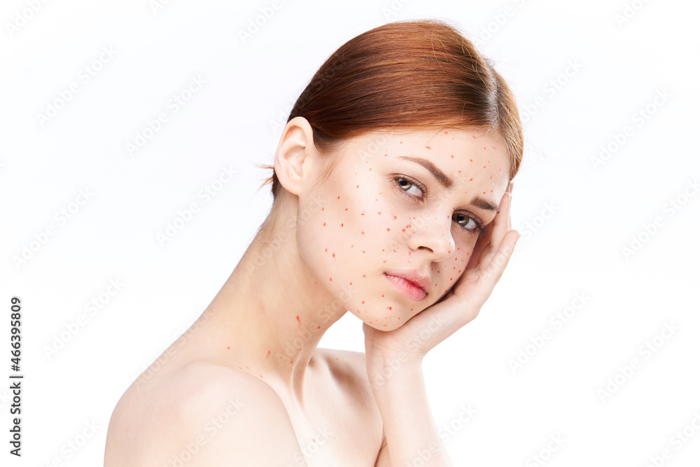 sad woman with bare shoulders red dots on her face sad woman with bare shoulders red dots on her face