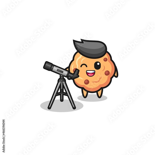 chocolate chip cookie astronomer mascot with a modern telescope