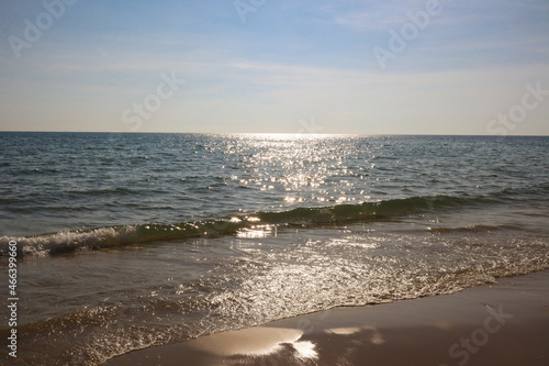 Ocean waves on the beach and clear sky