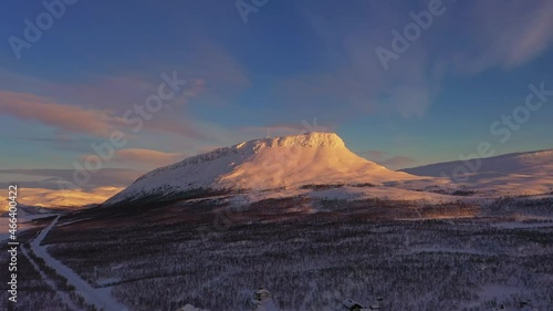 Aerial view of the Saana fell, winter sunrise in Lapland - tracking, drone shot photo