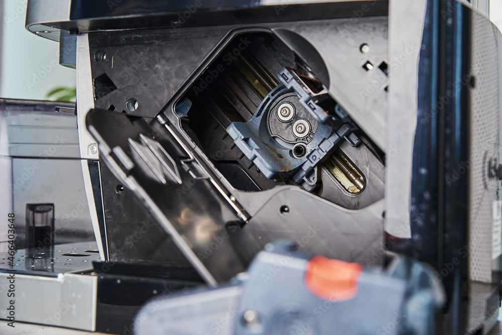 Automatic coffee machine cleaning. Open door in coffee machine for servicing mechanism. Household appliances maintenance Automatic coffee machine cleaning. Open door in coffee machine for servicing mechanism. Household appliances maintenance