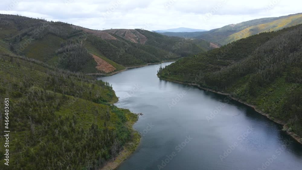 Amazing drone view of river Zêzere valleys on a cloudy sunny day. Backing off revealing landscape. Amazing drone view of river Zêzere valleys on a cloudy sunny day. Backing off revealing landscape.