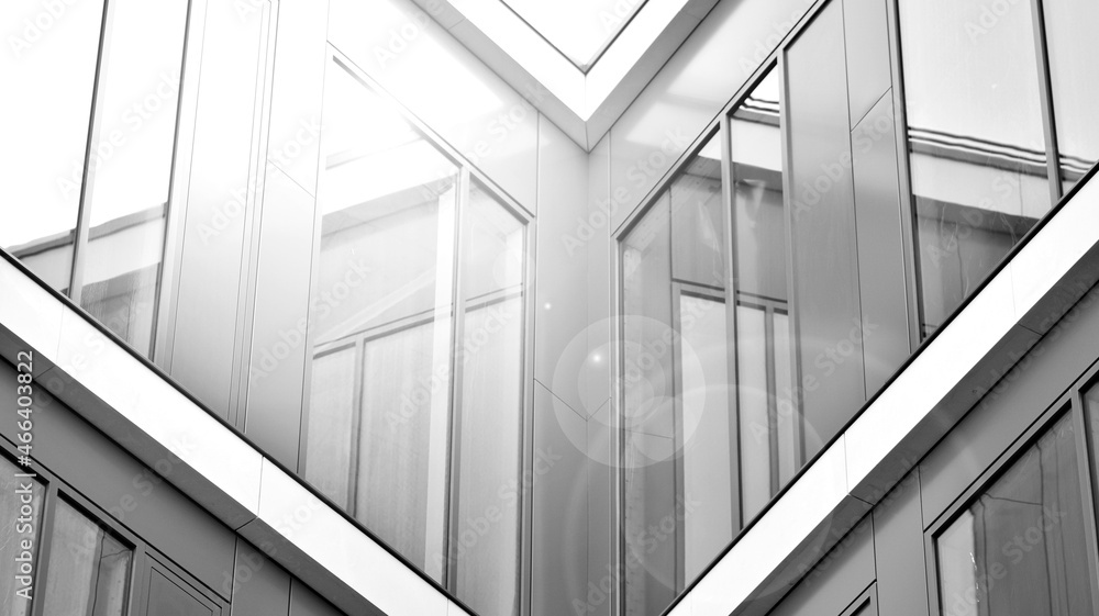 Obraz premium Corporate architecture building. New modern office building. Textured pane of contemporary glass architectural building. Black and white.