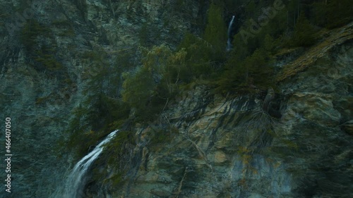 FPV drone shot towards the Jungfernsprung waterfall in Austria, sun flares - POV aerial photo