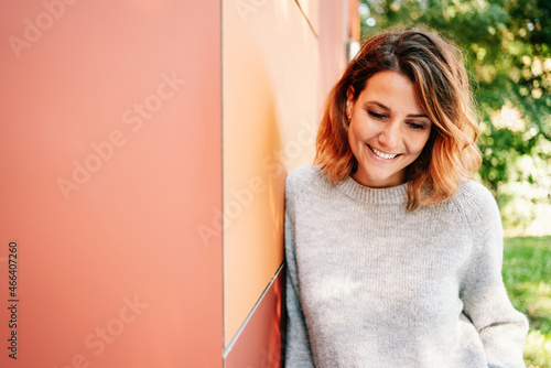 Photos Young woman deep in thought looking down at the ground