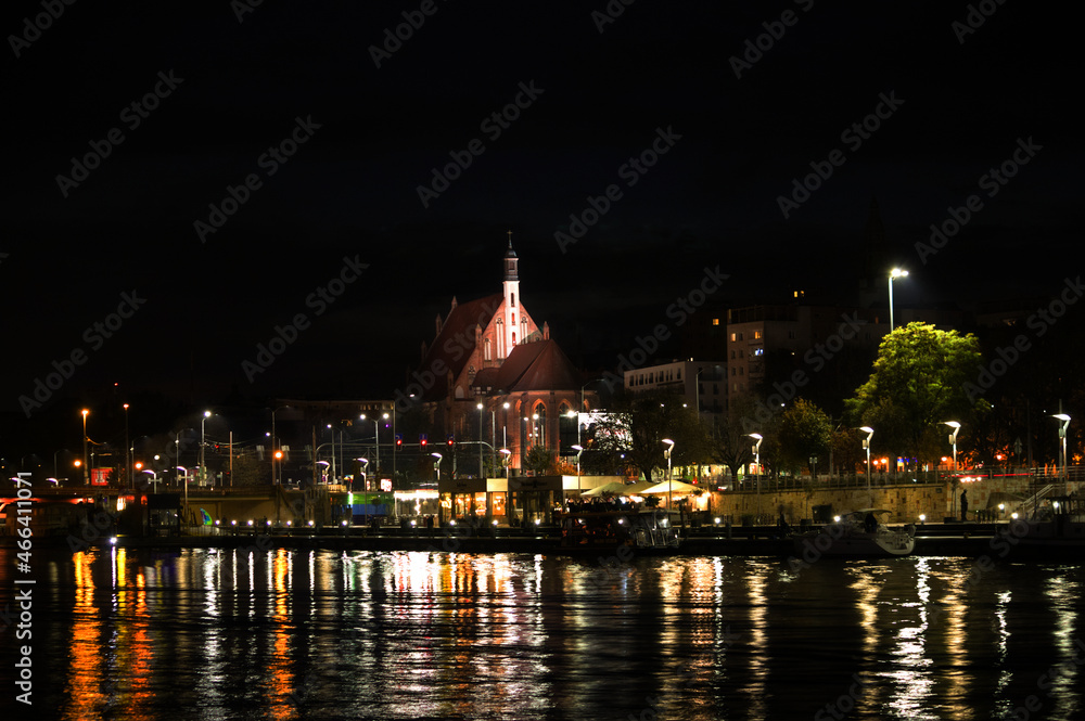 Obraz premium the historic parish of St. John the Evangelist seen at night, Szczecin, Poland