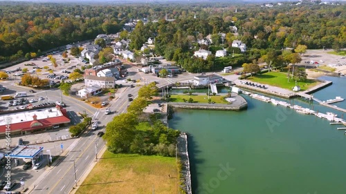 Aerial hyper lapse showing dynamic movement of traffic along the yacht club. Hingham, Massachusetts. photo