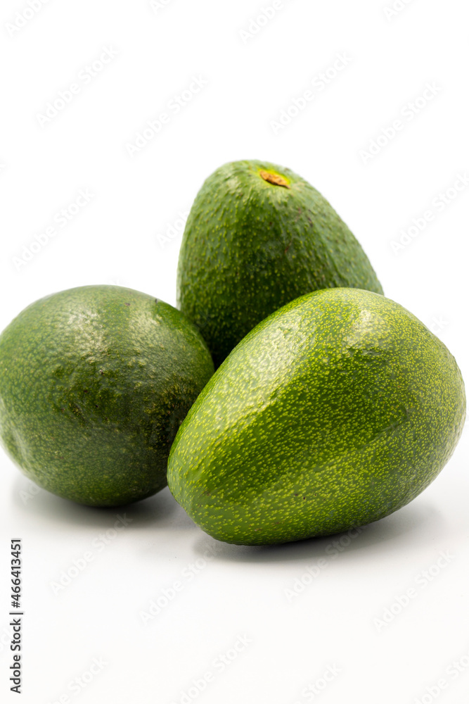 Avocado on a white background. Combined with the shade of ripe avocado. Story format close-up Avocado on a white background. Combined with the shade of ripe avocado. Story format close-up