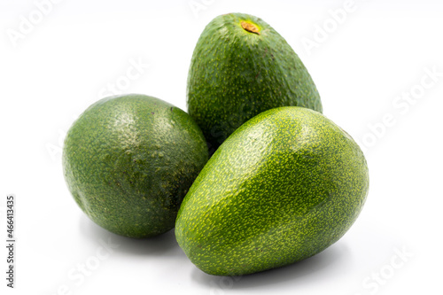 Avocado on a white background. Combined with the shade of ripe avocado. close up