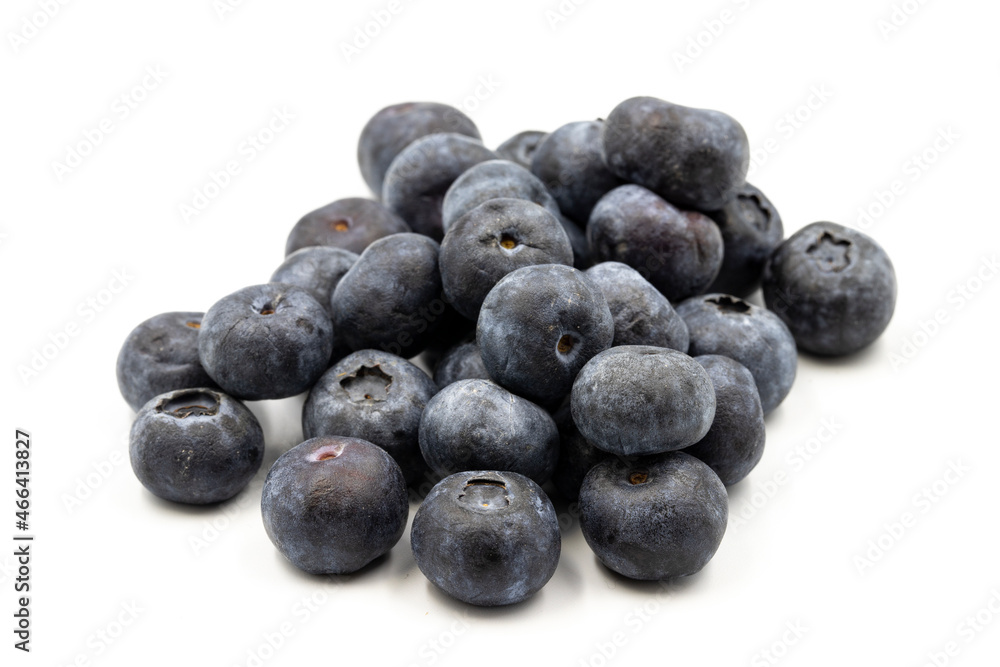 Blueberries on a white background. In combination with the shade of ripe blueberries. close up Blueberries on a white background. In combination with the shade of ripe blueberries. close up