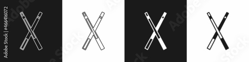 Set Crossed billiard cues icon isolated on black and white background. Vector