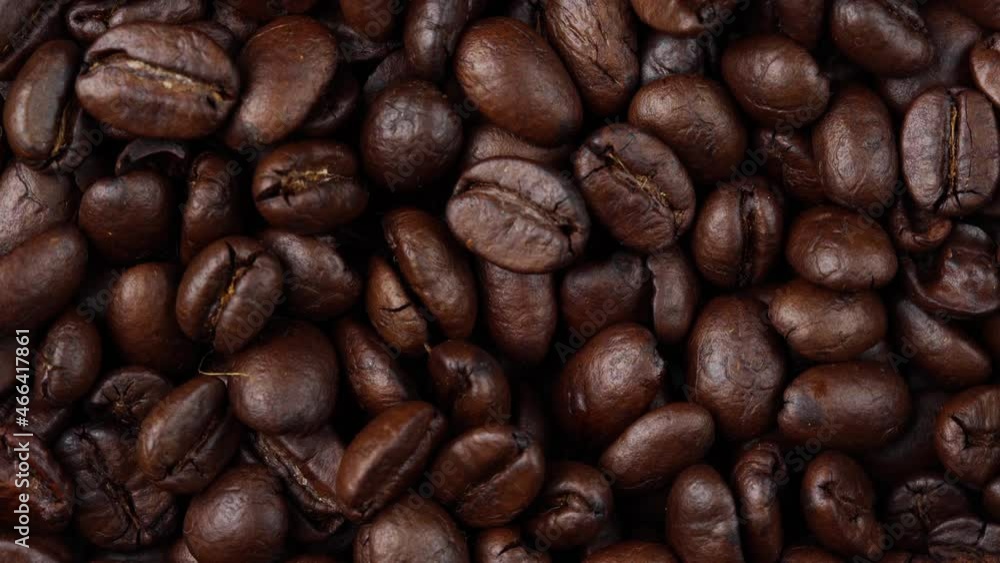 close up of roasted coffee beans rotating, seeds of coffee close up of roasted coffee beans rotating, seeds of coffee