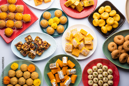 Group of Indian assorted sweets or mithai with diya photo