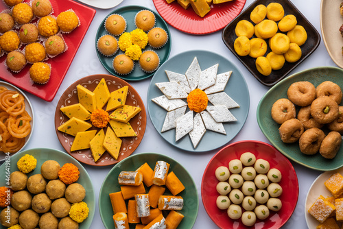 Group of Indian assorted sweets or mithai with diya photo
