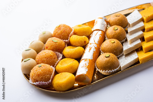 Group of Indian assorted sweets or mithai with diya