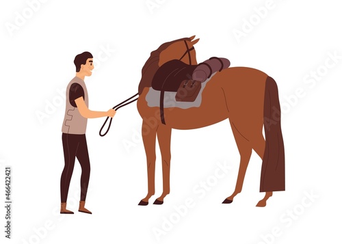 Man holding horse with harness straps. Rider standing near stallion with sadd...