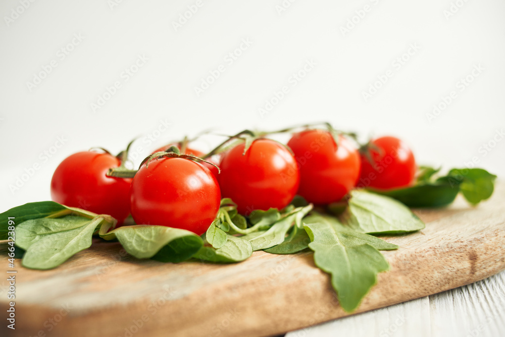 cherry tomatoes lettuce leaves wooden board fresh food