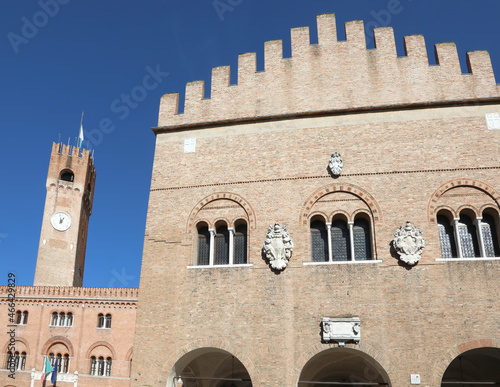 Palace called Palazzo dei Trecento and the CivicTower with clock in Main square of Treviso City in Italy photo