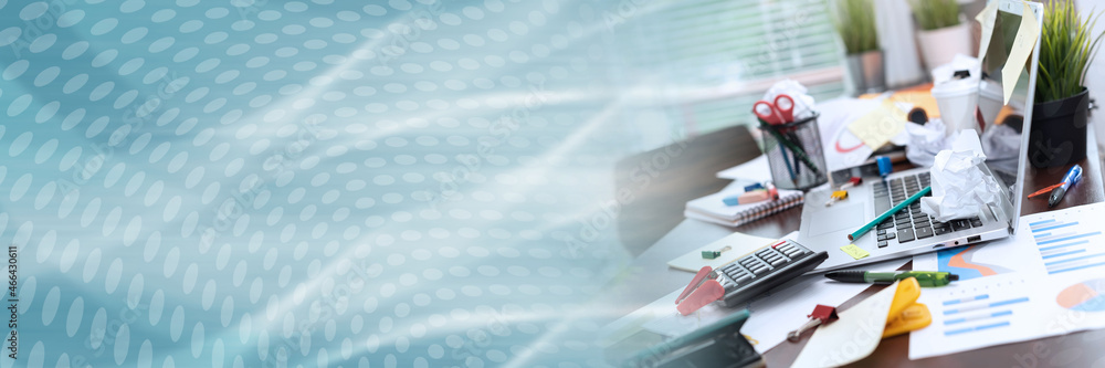 Messy and cluttered desk; panoramic banner Messy and cluttered desk; panoramic banner