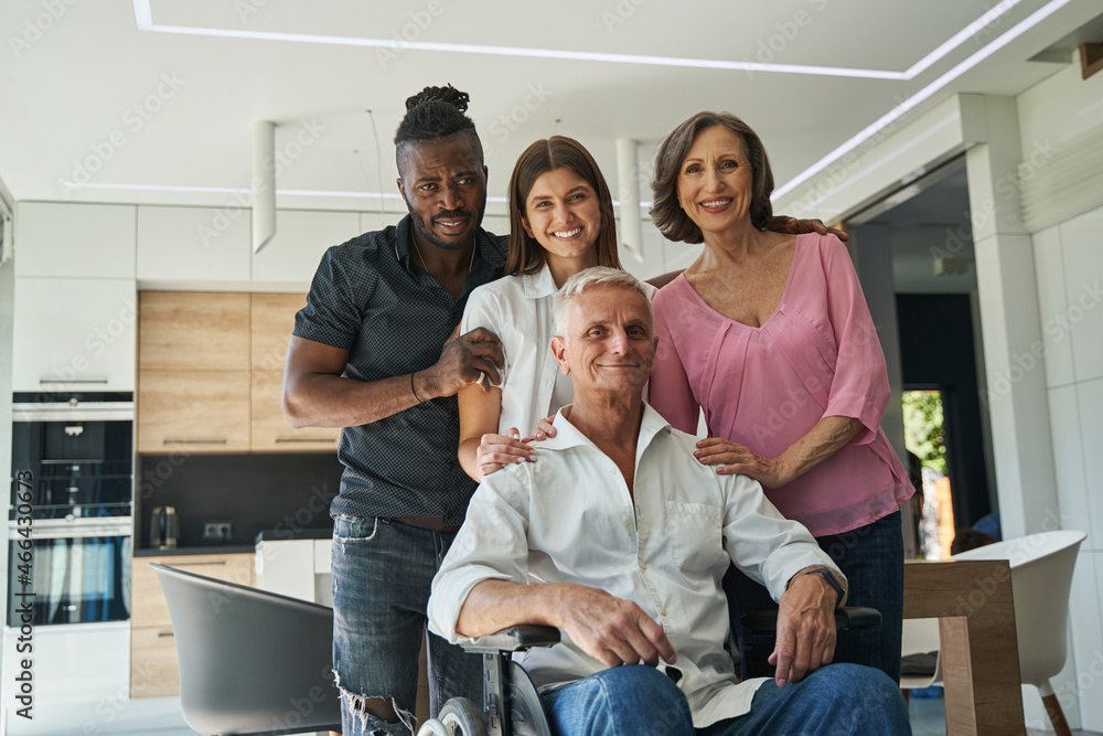 Relatives hugging and looking at camera with positive Relatives hugging and looking at camera with positive