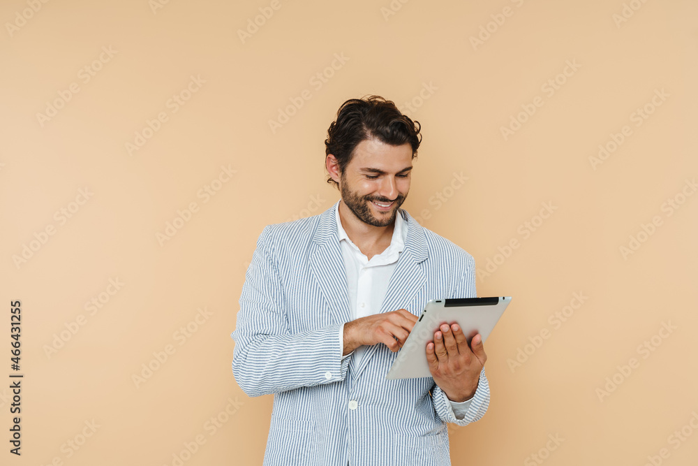 White bristle man smiling and using tablet computer White bristle man smiling and using tablet computer