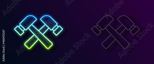 Glowing neon line Crossed hammer icon isolated on black background. Tool for repair. Vector