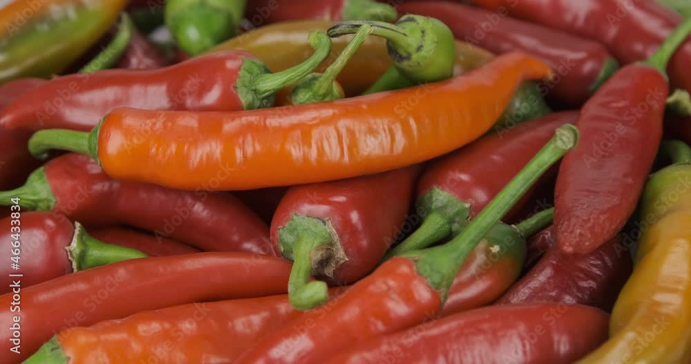 Rotating pile of ripe hot peppers. Vegetable background Rotating pile of ripe hot peppers. Vegetable background