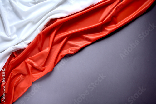 Polish flag on a gray background, copy space. Independence Day November 11, Poland.