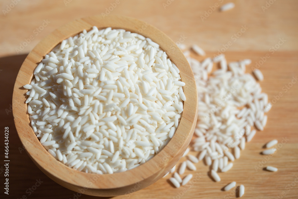 rice in a wooden bowl rice in a wooden bowl