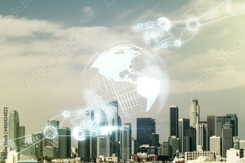 Abstract virtual robotics technology hologram with globe sketch on Los Angeles skyline background. Robot development and automation concept. Multiexposure