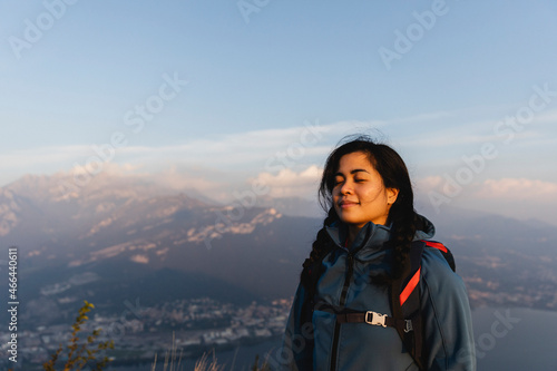 Young hiker inhaling on mountain