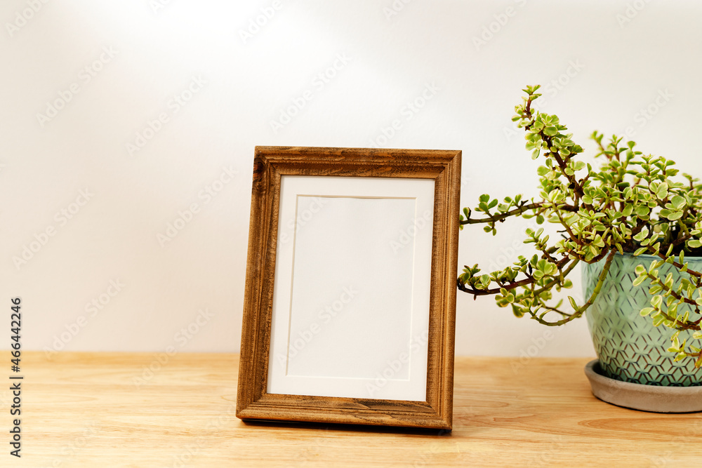 Blank decorative picture frame on wooden table Blank decorative picture frame on wooden table