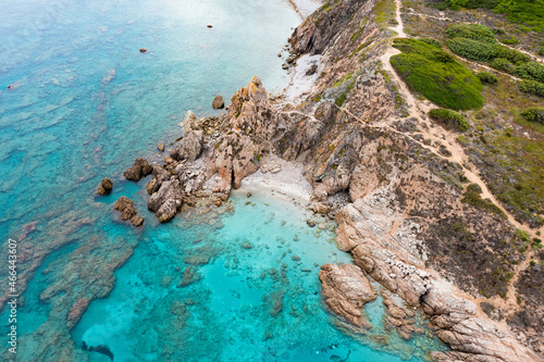 View from above  stunning aerial view of a rocky coastline bathed by a turquoise water. Rena Majore  Sardinia  Italy.