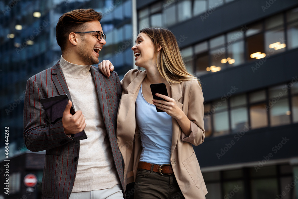 Portrait of successful business people working, talking together in urban background. Portrait of successful business people working, talking together in urban background.